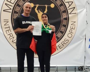 مدال آوری پدر و دختر وزنه بردار در قبرس بعلاوه عكس